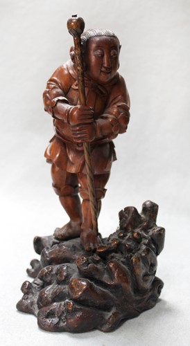 Lot 82 - An Asian carving of a boy, late 19th century