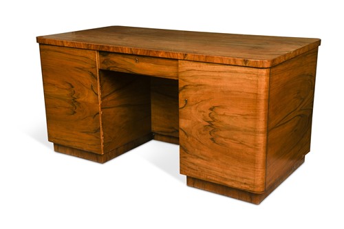 Lot 199 - Attributed to Georg Gnaier, a German Art Deco walnut pedestal desk