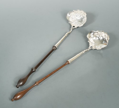 Lot 451 - Two George II silver punch ladles