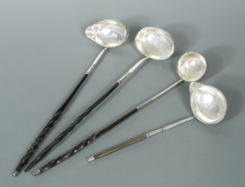 Lot 493 - Four George III silver punch ladles