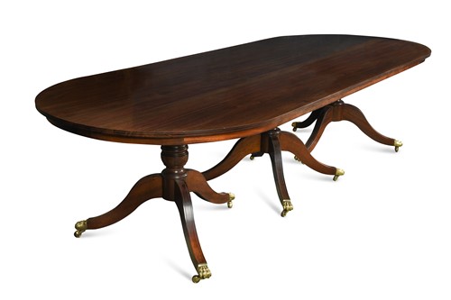 Lot 728 - A mahogany three pedestal dining table with one piece top