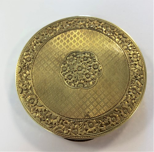 Lot 400 - A small travelling powder compact marked '585'