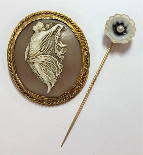 Lot 24 - A shell cameo brooch and a banded agate and pearl set stick pin