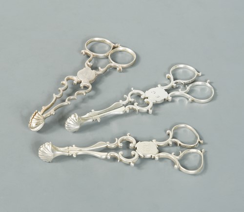 Lot 467 - Three pairs of 18th Century George III silver tea tongs