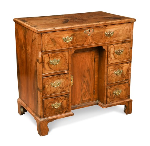 Lot 89 - A George II walnut kneehole desk
