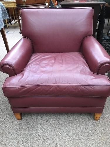 Lot 317 - A red leather easy armchair, modern