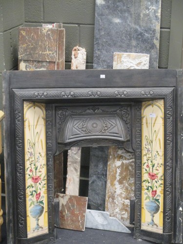 Lot 367 - A tiled cast iron fire place with marble...