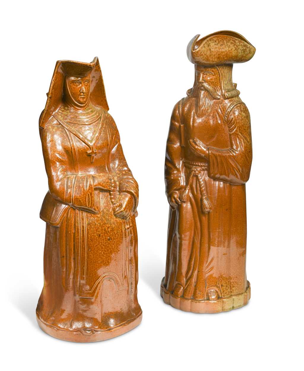 Lot 20 - A rare pair of Doulton Lambeth salt glazed figural jugs