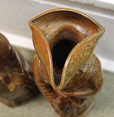 Lot 20 - A rare pair of Doulton Lambeth salt glazed figural jugs