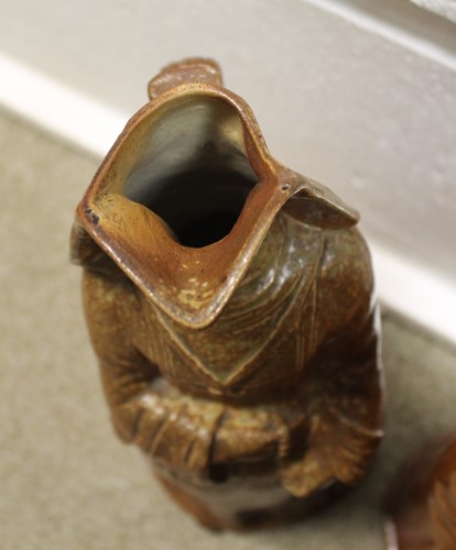 Lot 20 - A rare pair of Doulton Lambeth salt glazed figural jugs