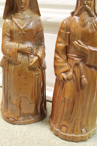 Lot 20 - A rare pair of Doulton Lambeth salt glazed figural jugs