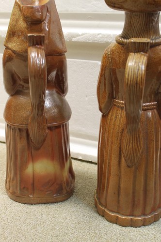Lot 20 - A rare pair of Doulton Lambeth salt glazed figural jugs
