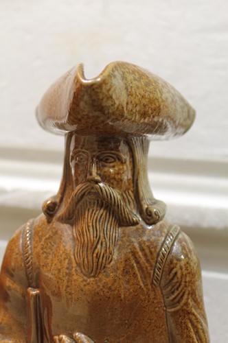 Lot 20 - A rare pair of Doulton Lambeth salt glazed figural jugs