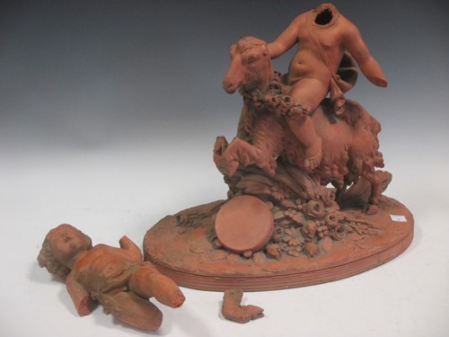 Lot 59 - A 19th century terracotta group of putto...
