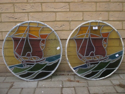 Lot 172 - A pair of 1930's stained glass roundels with...
