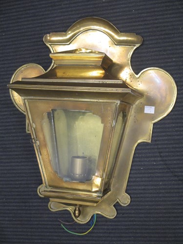 Lot 26 - A brass cased wall light