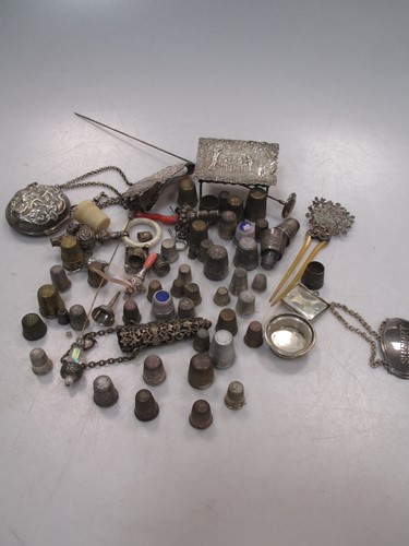 Lot 110 - A large collection of thimbles, together with...
