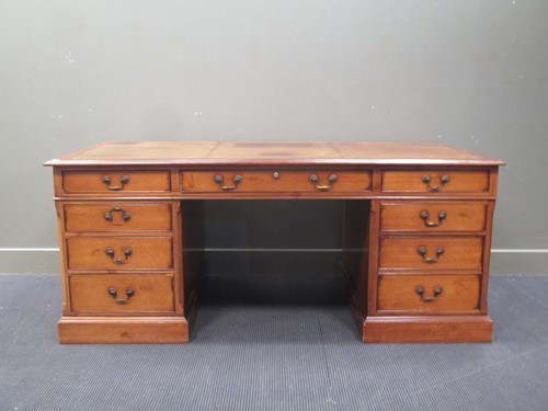Lot 306 - A mahogany pedestal desk in the Georgian style...