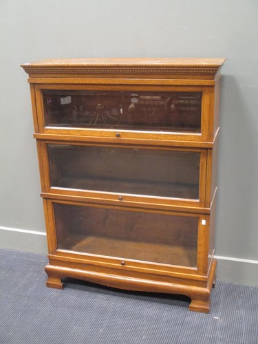 Lot 292 - Three tier oak stacking bookcase by Simpoles...