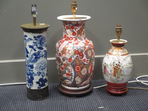 Lot 148 - Three oriental vases converted for electricity,...