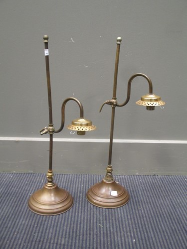 Lot 160 - A pair of adjustable brass lamps