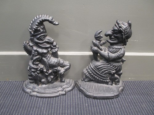 Lot 149 - Two modern cast iron punch and Judy doorstops...