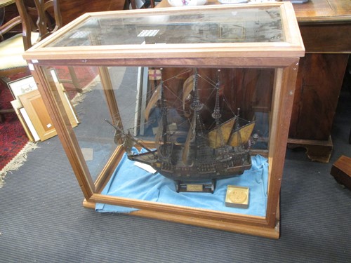 Lot 32 - A cased model of a sailing ship, case measures...