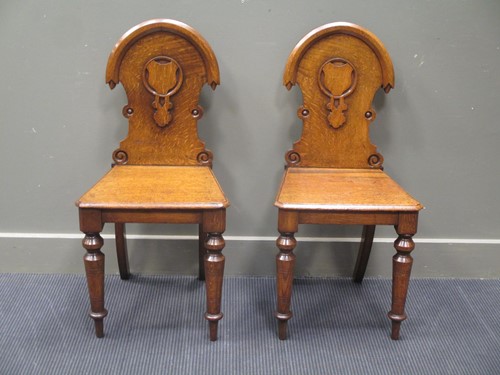 Lot 348 - A pair of late Victorian oak hall chairs (2)