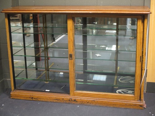 Lot 376 - A haberdashery display unit with two sliding...