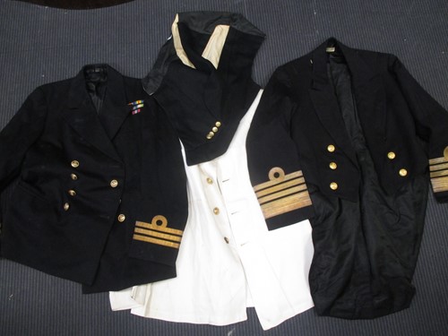 Lot 145 - Six Royal Naval tunics, various waistcoats,...