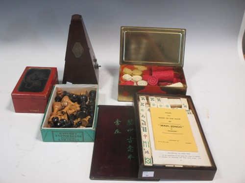 Lot 74 - A Mah-Jongg set, stained ivory gaming counters,...