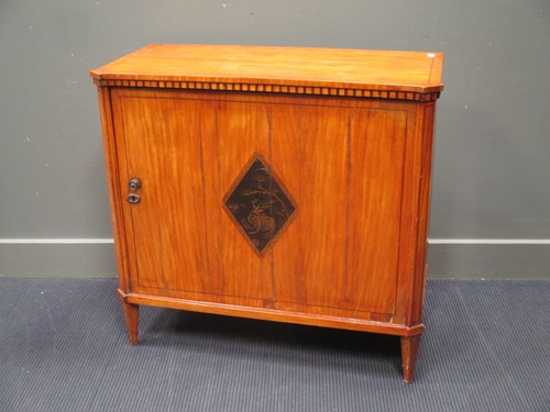 Lot 336 - A Continental side cabinet, the door with a...