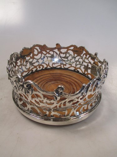 Lot 129 - A Victorian silver bottle coaster