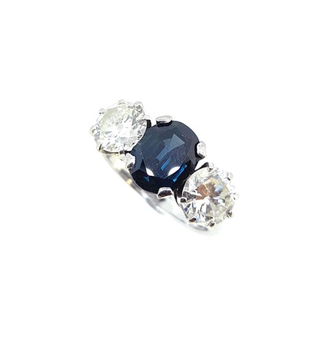 Lot 180 - A sapphire and diamond three stone ring
