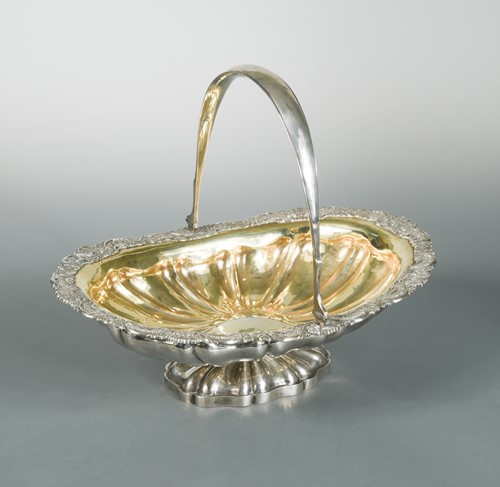 Lot 417 - A 19th century Russian metalwares silver swing handled cake basket