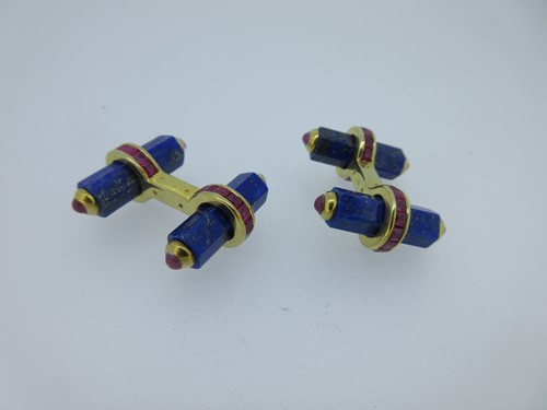 Lot 115 - A pair of baton cufflinks each set with lapis lazuli and rubies