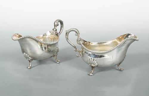 Lot 459 - A pair of George II silver sauce boats