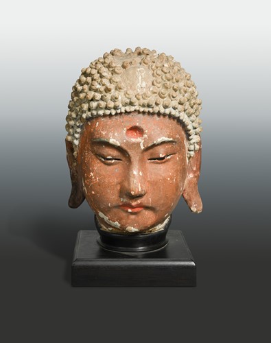 Lot 144 - A painted stucco head of Buddha, perhaps Jin Dynasty (1115 A.D - 1234 A.D)