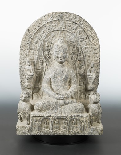 Lot 152 - A Chinese grey veined stone Buddhist triad group, Northern Wei Dynasty style