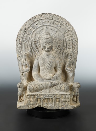 Lot 154 - A Chinese grey veined stone Buddhist triad group, Northern Wei Dynasty style