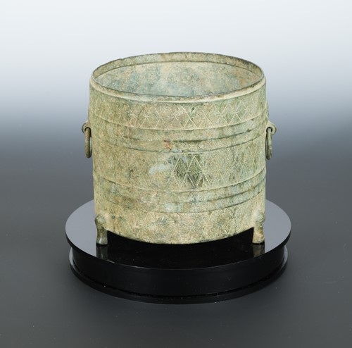Lot 155 - A Chinese bronze tripod cylindrical vessel Zun, probably Warring States