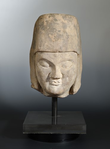 Lot 111 - A Chinese cream stone male head, with headdress, perhaps Tang