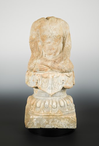 Lot 113 - A Chinese pale stone seated Buddha on pedestal, headless, perhaps northern Qi