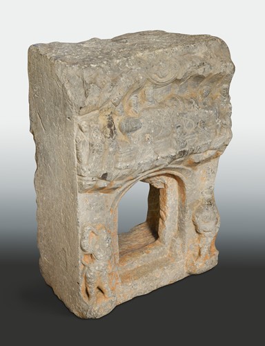 Lot 114 - A Chinese grey stone architectural fragment,  possibly 6th/8th century, carved with recumbent Buddha
