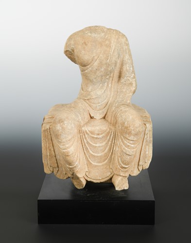 Lot 117 - A Chinese white marble seated Buddhist deity, torso only, Wei Dynasty style