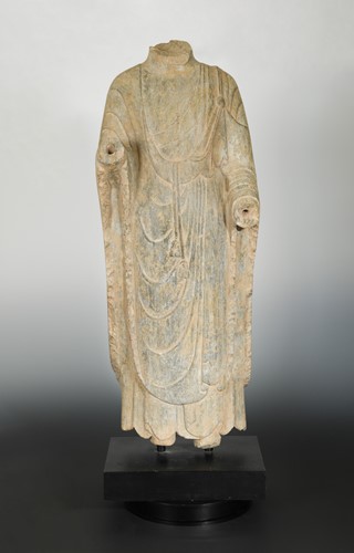 Lot 132 - A Chinese grey limestone torso of Buddha standing, Wei Dynasty style
