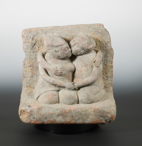 Lot 133 - A Chinese carved greystone group of a Chinese couple in loving embrace