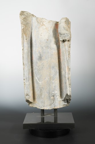 Lot 135 - A Chinese grey limestone fragment of the robed Buddha, perhaps Northern Qi Dynasty