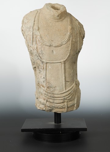 Lot 159 - A Chinese sandstone torso of Avalokiteshvara, in Sui/early Tang style