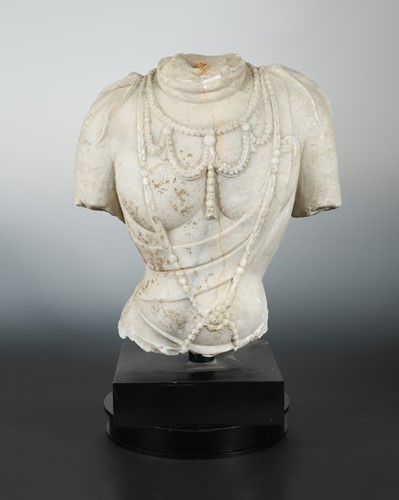 Lot 160 - A Chinese white marble fragmentary upper body of Avalokiteshvara, or Manjusri, in Tang Dynasty style